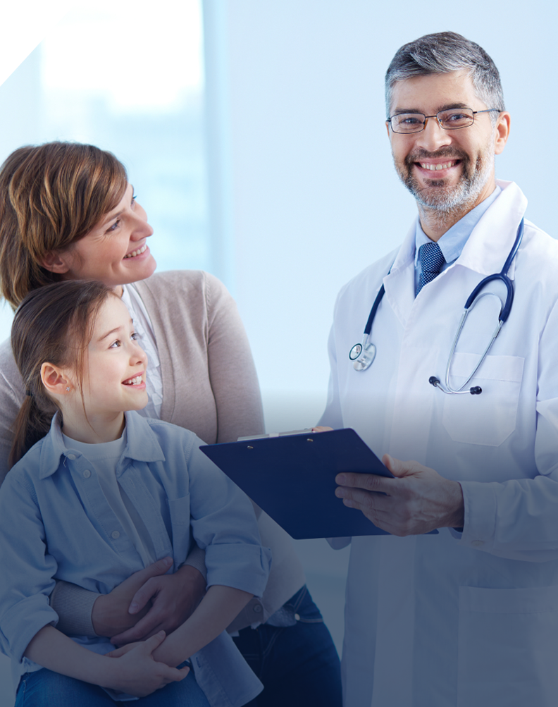 A doctor and two women with a child.